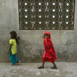 WALKING IN FEAR. Girls walk through a street in Gojra town, located in Punjab province. Residents of the neighborhood, known as Christian Colony, are haunted, since 2009, by memories of Muslim attacks on families there. 