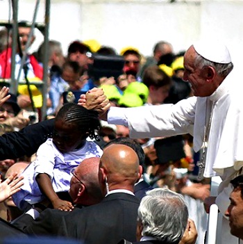 Pope Francis rides through St. Peter’s Square after Mass.