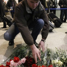 A man lays flowers on the floor Jan. 25 in memory of those killed in a bombing at Moscow's Domodedovo Airport. Terrorists detonated a bomb Jan. 24 at the Moscow airport, killing at least 35 people and wounding more than 150, Russian authorities said. 