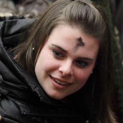 A young woman with ashes on her forehead attends Pope Benedict XVI's general audience in Paul VI hall at the Vatican March 9. Ash Wednesday marks the start of the penitential season of Lent.