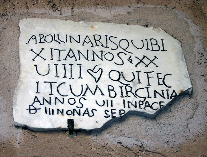 Ancient Christian funerary plaque in Santa Maria degli Angeli, Rome, Italy, for a man named Apollinaris, who lived 29 years, 7 of which with his wife Virginia.