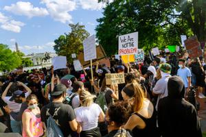 Protesters march after death George Floyd, group standing against White House on May 31, 2020.