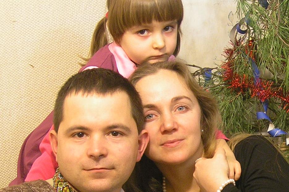 Mykola and Tania Symchych with their 3-year-old daughter, Olenka.