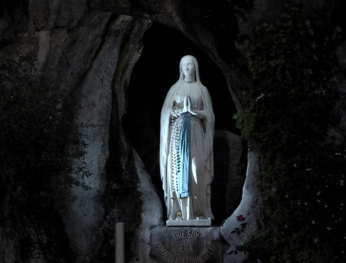 A statue of Our Lady of Lourdes is seen in the grotto at the shrine of Our Lady of Lourdes in Lourdes, France.