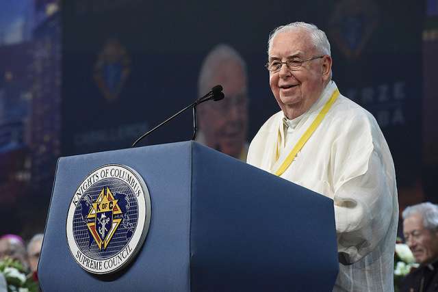 Maryknoll Father Gerard Hammond speaks at the 2017 Knights of Columbus Convention after receiving the Gaudium et Spes Award. 