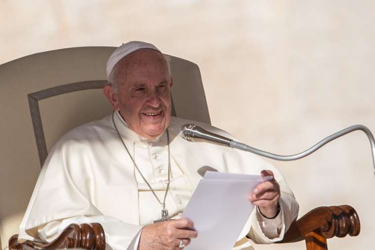 Pope Francis speaks at the general audience Oct. 9.