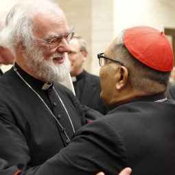 DIALOGUE. Anglican Archbishop Rowan Williams of Canterbury greets Cardinal Ivan Dias, prefect of the Congregation for the Evangelization of Peoples, at the conclusion of the 50th anniversary celebration of the Pontifical Council for Promoting Christian Unity at the Vatican Nov. 17. 