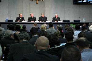 From left to right, Bishop Enrico Solmi of Italy, Archishop Mark Coleridge of Australia, Patriarch Fouad Twal of Jerusalem and Father Federico Lombardi, the director of the Holy See Press Office, give a press briefing during the Ordinary Synod of Bishops on the Family on Oct. 19 at the Vatican.