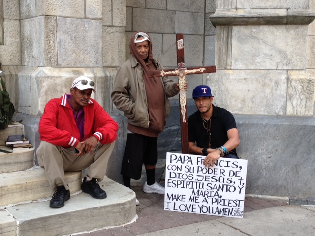 Mauro Avila (holding crucifix) and friends