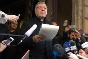 Cardinal George Pell, prefect of the Vatican's Secretariat of the Economy, speaks to reporters outside Rome's Hotel Quirinale after meeting with sex abuse survivors on March 3, 2016.