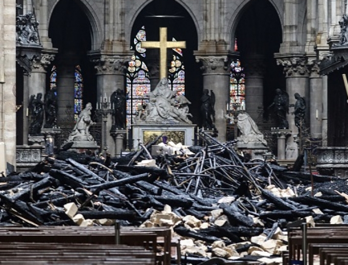 The Notre Dame altar is surrounded by charred debris April 16 amid the aftermath of the fire that devastated the cathedral April 15. 
