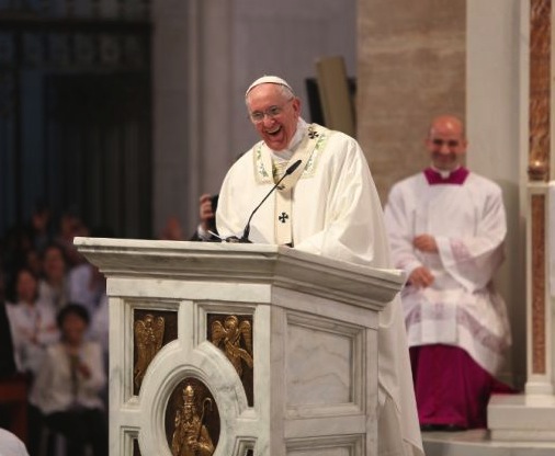 Pope Francis laughs during his Jan. 16 homily at Manila's Our Lady of the Immaculate Conception Cathedral.