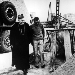 In an undated photo, Cardinal Karol Wojtyla visits with a worker at the site of the future Mother of God, Queen of Poland Church in Nowa Huta, Poland. After years of negotiations, the future Pope John Paul II received permission from Polish communist authorities to begin construction. He laid the cornerstone on his 49th birthday. Pope Paul VI donated the cornerstone, an original brick from Constantine's ancient Basilica of St. Peter in Rome.
