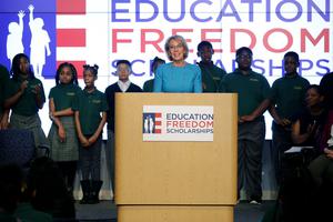 Education Secretary Betsy DeVos stands in front of students from Digital Pioneers Academy during an event to discuss her proposal for Education Freedom Scholarships at the Education Department headquarters Feb. 28. According to the department, the scholarships would 'significantly expand education freedom for millions of students and families across the country.' 