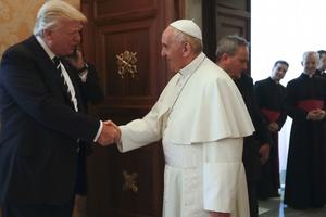 Pope Francis greets President Donald Trump May 24 at the Vatican. The U.S. president renewed his commitment to fighting global famine and announced a new multi-million-dollar American aid contribution to four African nations in crisis.