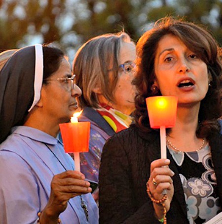 A group of Catholic faithful take part in a prayer vigil.


