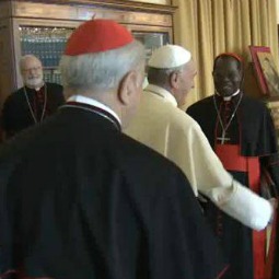 Pope Francis greets members of the council of cardinals at the start of their first meeting, Oct. 1, 2013.