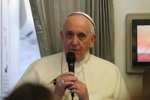 Pope Francis speaks to journalists on his flight from Sri Lanka to the Philippines on Jan. 15.
