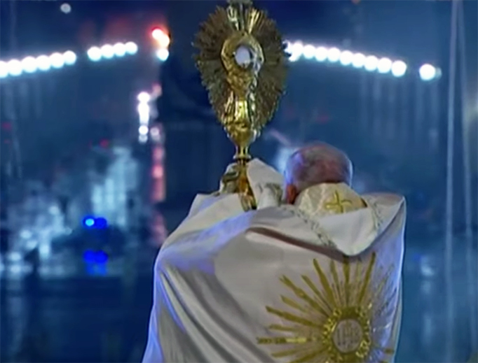 Pope Francis holds aloft the Blessed Sacrament in St. Peter’s Square on March 27, 2020