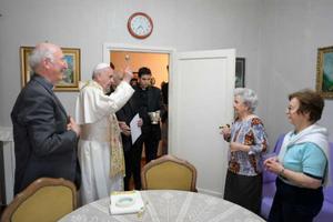 Pope Francis blesses a home in Ostia, Italy, May 19.