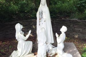 Above, the Asbury, New Jersey, shrine highlights Marian devotion in a serene setting, including a statue scene of the seers and Our Lady. Below, the Holliston, Massachusetts, shrine celebrates the Blessed Mother among nature’s beauty. 