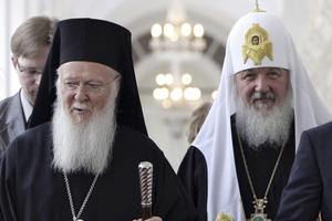 In this file photo taken May 25, 2010, Ecumenical Patriarch Bartholomew I of Constantinople, left, and Russian Orthodox Patriarch Kirill tour the Kremlin during a meeting in Moscow, Russia.