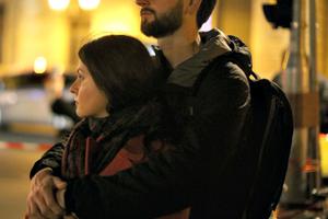 A couple gathers outside Notre Dame Cathedral during a ceremony to honor the victims of the Nov. 13 Islamist terrorist attacks on Nov. 15 in Paris.