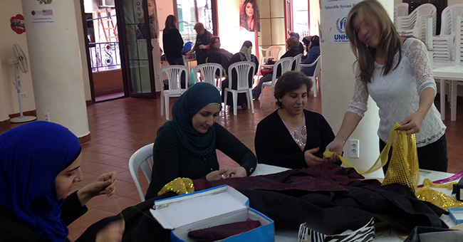 Three Syrian refugees being trained in tailoring skills by Caritas are determined to return home: Two Muslim women from Homs and a Catholic from Aleppo, who've become friends through the Caritas program.