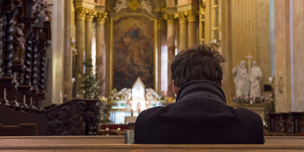Man Praying in Church