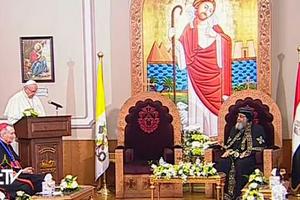 Pope addresses Coptic Orthodox Patriarch Tawardos II at Coptic Orthodox cathedral April 28.