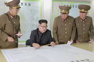 This image made from video of an Aug. 14 still image broadcast in a news bulletin on Aug. 15 by North Korea's KRT shows North Korean leader Kim Jong Un receiving a briefing in Pyongyang. North Korea said the leader was briefed on his military's plans to launch missiles in waters near Guam days after the Korean People's Army announced its preparing to create "enveloping fire" near the U.S. military hub in the Pacific. Independent journalists were not given access to cover the event depicted in this photo. 