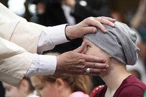 Pope Francis visits sick children at Krakow hospital on July 29.