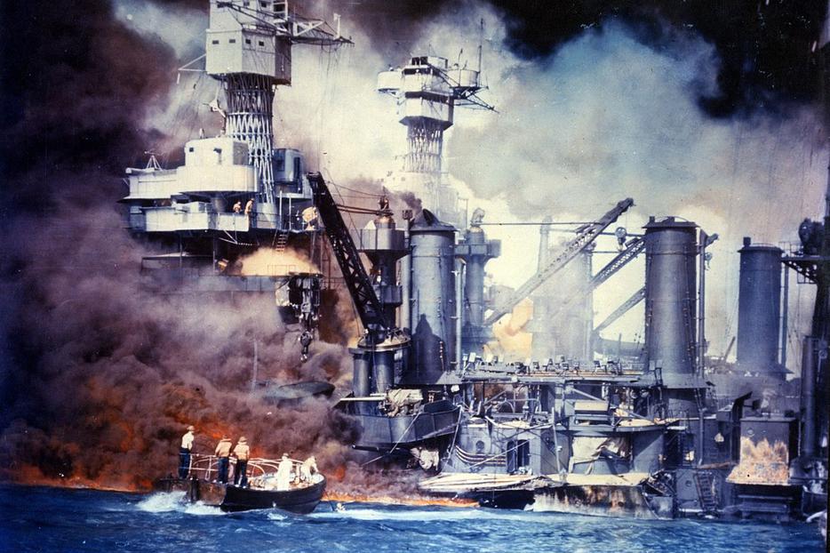 American sailors rescue a survivor from the water alongside the USS West Virginia on December 7, 1941.