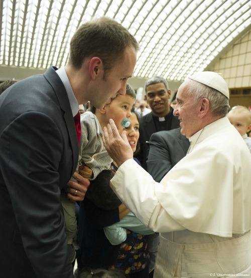  Pope Francis meets with a family during an audience with the Neocatechumenal Way in the Vatican's Paul VI Hall on March 18.