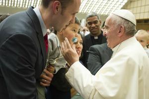  Pope Francis meets with a family during an audience with the Neocatechumenal Way in the Vatican's Paul VI Hall on March 18.