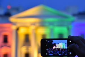 A PICTURE THAT DEFINES A DECADE. A person uses a smartphone to take a photo of the White House lit in rainbow colors, June 26, 2015, following the U.S. Supreme Court’s Obergefell decision mandating same-sex marriage nationwide.