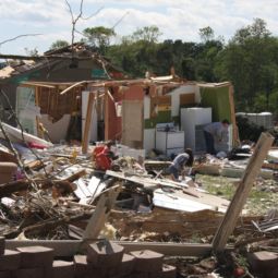 A man and woman look over the remains of their home April 28 after a tornado destroyed it the previous day in Cleveland, Tenn. At least 34 people died in Tennessee from the storms that caused widespread damage and killed more than 340 people across the South. 