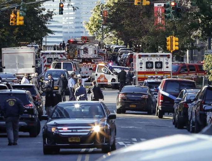 Emergency personal respond after reports of multiple people hit by a truck after it plowed through a bike path in lower Manhattan Oct. 31 in New York City.
