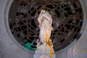 Detail of a vandalized statue is seen outside a looted church during the 23rd consecutive day of protests on Nov. 9 in Santiago, Chile. 