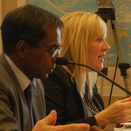 Dr. Sabu George (l) listens as Jill McElya (r), a human-rights lawyer with the Invisible Girl Project, speaks.