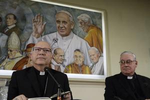 Auxiliary Bishop Luis Fernando Ramos Perez of Santiago de Chile (l) and Bishop Juan Ignacio Gonzalez of San Bernardo meet reporters at the Vatican May 14.