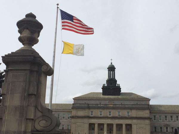 U.S. and Vatican flags fly at St. Charles Borromeo Seminary outside of Philadelphia.