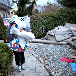 Trisha McAvoy of Brick Township, N.J., evacuates her home due to an approaching storm Nov. 6.