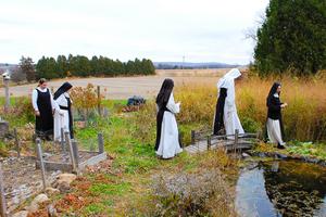 Valley of Our Lady Cistercian Monastery is attracting millennial vocations, offering peace and solitude for garden walks and processions with and adoration of the Blessed Sacrament and  praying of the Divine Office in choir. Also shown: Sister Mary Bede prostrates during her solemn profession on Nov. 17, 2012. Saying the prayers of solemn consecration was the sisters' abbot at that time, Abbot Anselm of the Abbey of Mehrerau, in Austria, the head of the sisters' congregation. The sisters belong to a group of Swiss-Austrian-German monasteries. 
