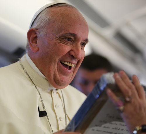 Pope Francis receives a gift of a bas-relief of St. Thérèse of Lisieux from journalist Caroline Pigozzi of Paris Match on Jan. 15.
