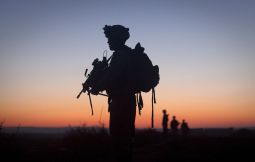 Lance Cpl. James Harris, with the 2nd Battalion 2nd Marines from Camp Lejeune, N.C., is silhouetted at dawn during an operation in the Garmsir district of Helmand Province, Afghanistan, Dec. 23. 