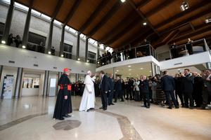 Pope Francis is shown making a surprise visit on March 25, 2019, to the Pontifical Lateran University, where he led the Lenten "Lectio Divina" meditation that the university organizes every year for the academic community. The university resumes in-person classes next month.