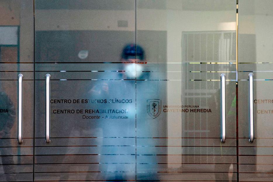 A health worker remains inside the clinical studies center of the Cayetano Heredia University in Lima on September 09, 2020, where a Chinese potential vaccine against COVID-19 will be tested on volunteers. The clinical testing phase of a Chinese potential vaccine against COVID-19 started Wednesday in Peru, where 6,000 volunteers will get it.