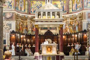 A celebration of Mass inside the Basilica of Santa Maria in Trastevere, Rome.