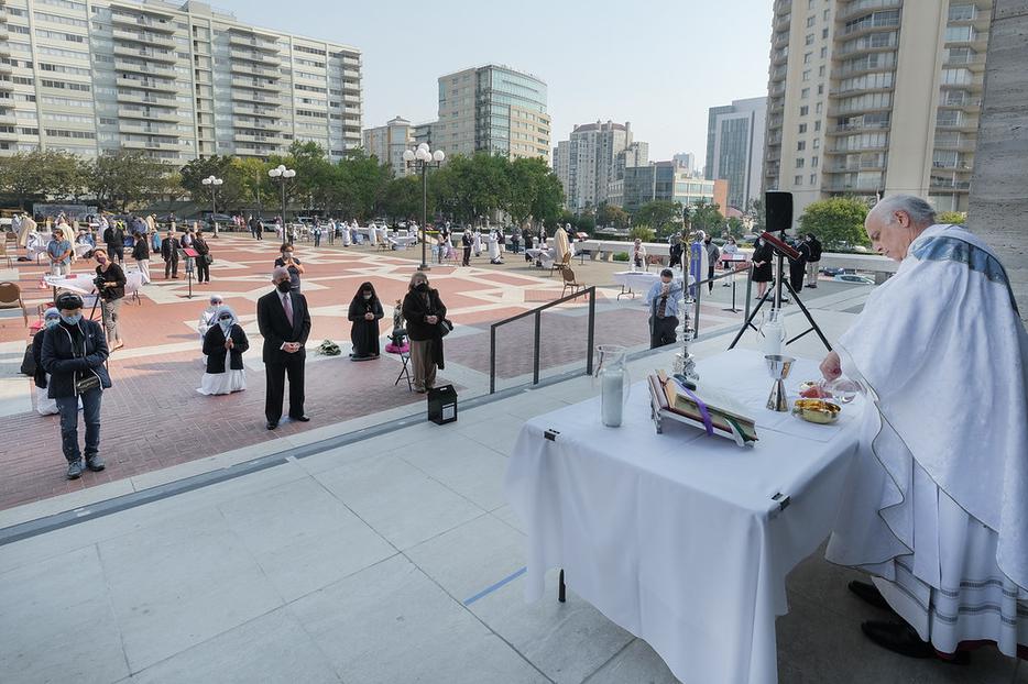 Archbishop Salvatore Cordileone celebrates Mass on the plaza of St. Mary's Cathedral in San Francisco on Aug. 22.  The archbishop is leading a movement to 'Free the Mass' due to restrictions imposed by the mayor amid the pandemic.